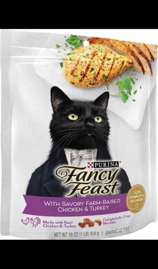 A pouch of Purina Fancy Feast cat food featuring a black cat in a tuxedo, followed by elegantly dressed people at a dinner table eating small morsels and giving a thumbs up.