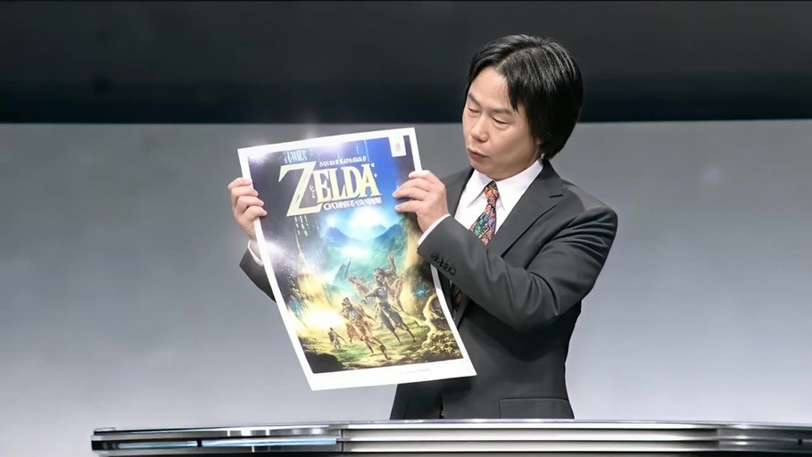 A man in a suit holding a Legend of Zelda poster laughs with lightning in the background.