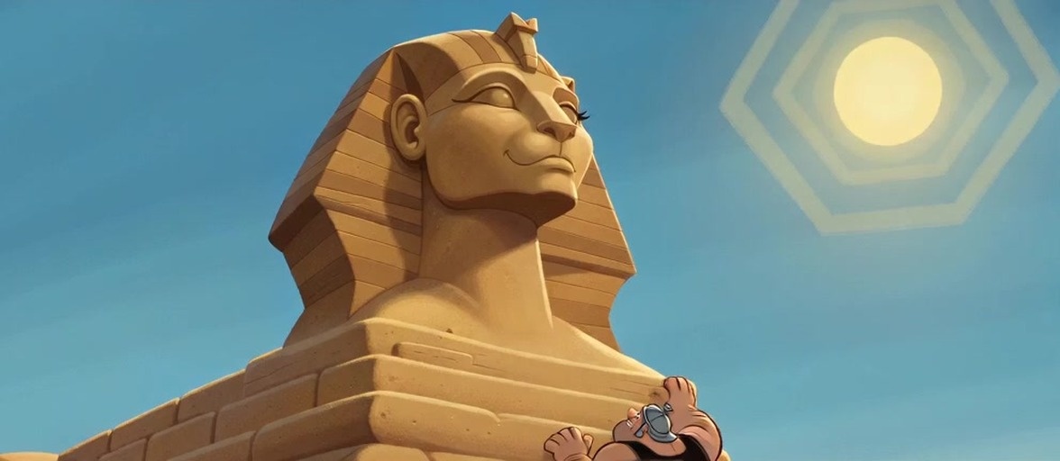 Two muscular men in ancient Egyptian attire stand in a desert near a large pyramid under a bright blue sky.