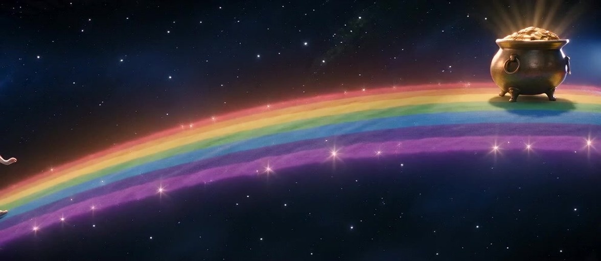 A stylized male leprechaun in a green coat and fedora squats against a starry night sky with a rainbow.