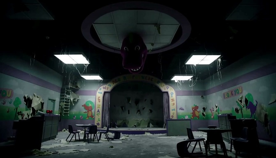 A police officer with a flashlight explores a dark, ruined children's playroom where a large Barney head hangs from the ceiling before the dinosaur emerges from behind a curtain.